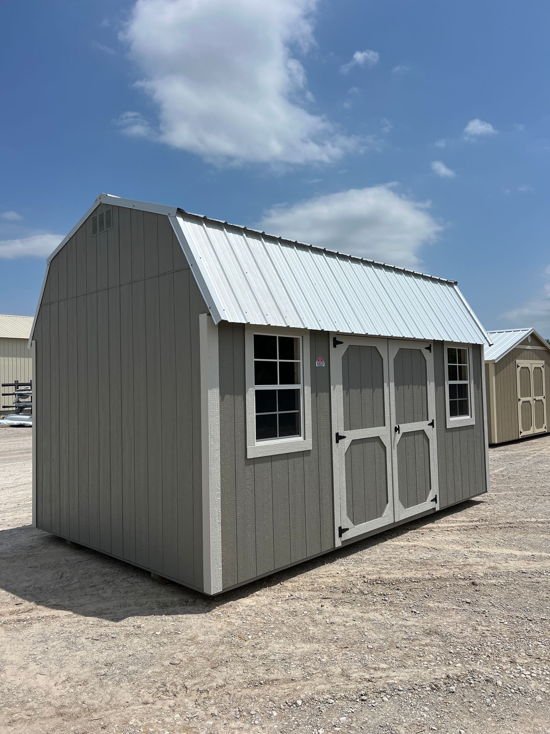 Explore the Derksen Best Value Wood Side Lofted Barn 10x16 with